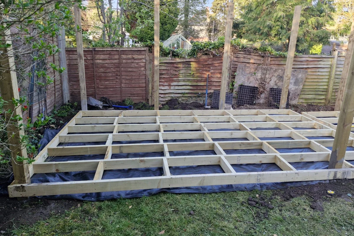 Bedfordshire Decking Builders installer laying composite deck boards