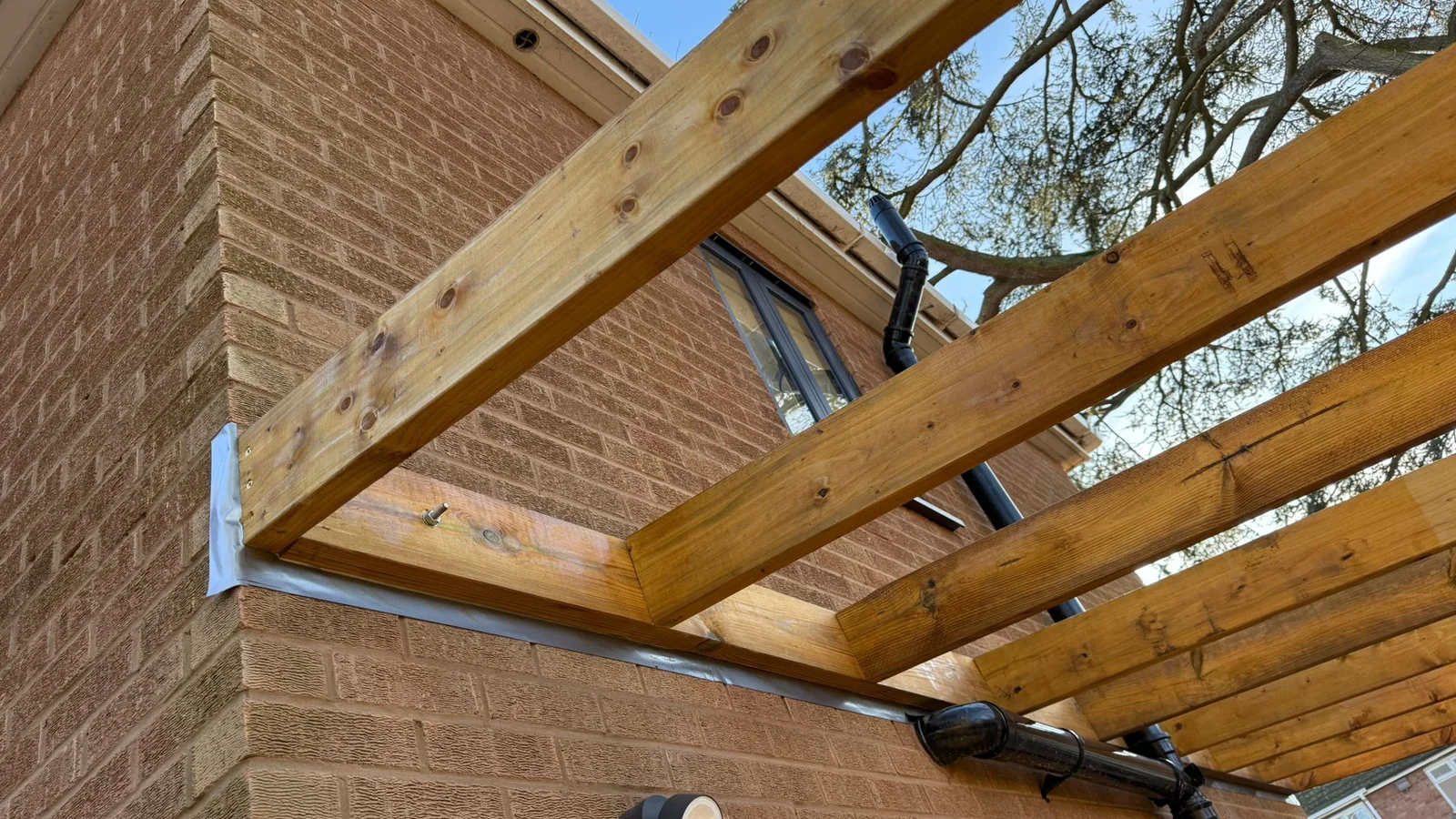 Premium aluminium pergola over a British garden patio