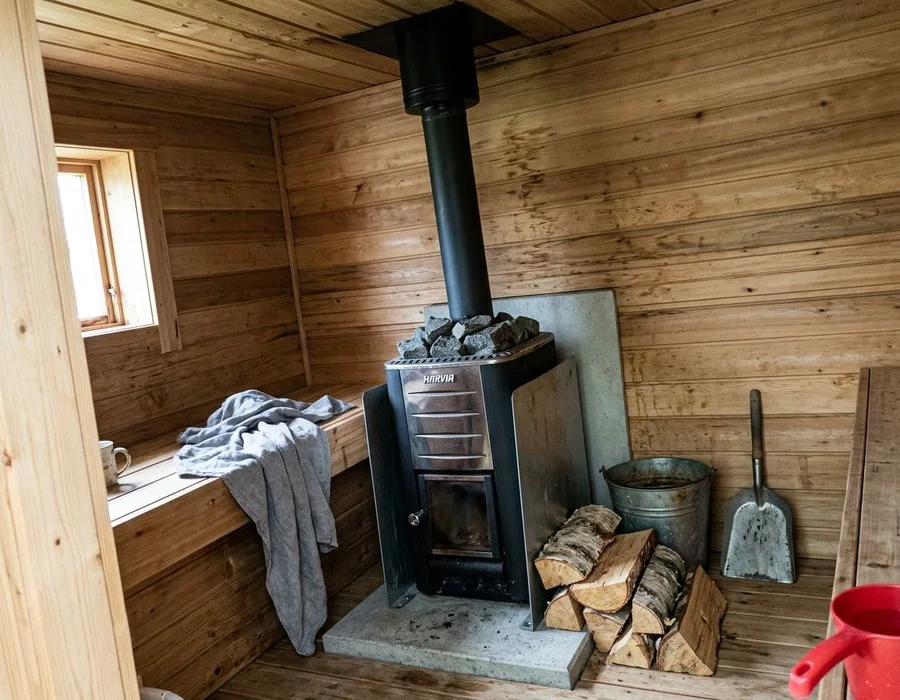 Wood-fired sauna stove with flue detail